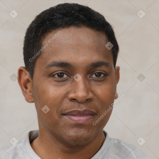 Joyful black young-adult male with short  brown hair and brown eyes
