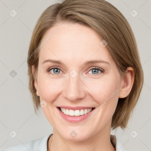 Joyful white young-adult female with medium  brown hair and grey eyes