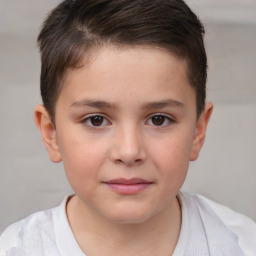 Joyful white child male with short  brown hair and brown eyes