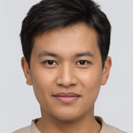 Joyful asian young-adult male with short  brown hair and brown eyes