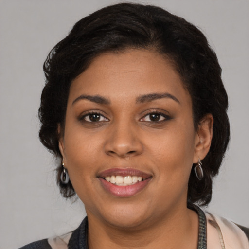 Joyful latino young-adult female with medium  black hair and brown eyes