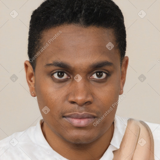 Joyful black young-adult male with short  brown hair and brown eyes