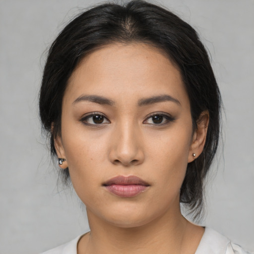 Neutral asian young-adult female with medium  black hair and brown eyes