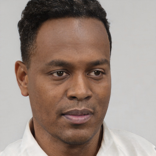 Neutral black young-adult male with short  brown hair and brown eyes