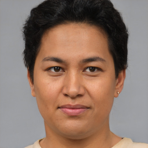 Joyful asian adult female with short  brown hair and brown eyes
