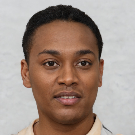 Joyful latino young-adult male with short  brown hair and brown eyes