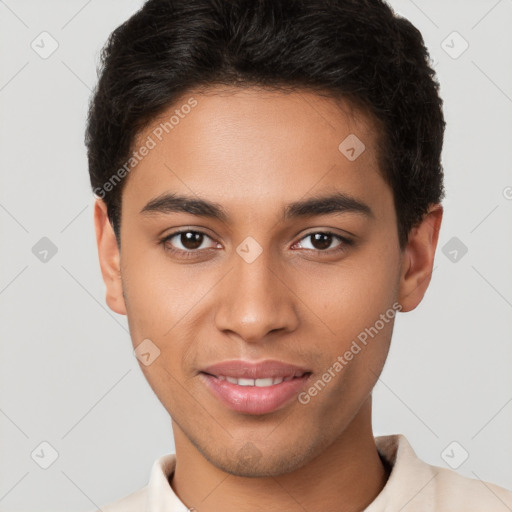 Joyful latino young-adult male with short  brown hair and brown eyes