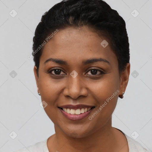 Joyful black young-adult female with short  brown hair and brown eyes