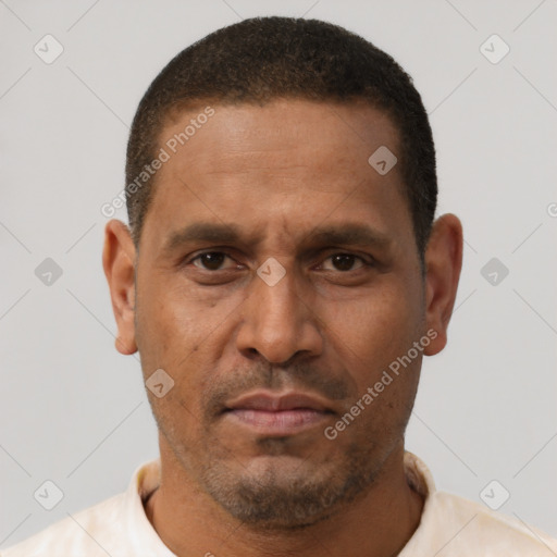 Neutral latino adult male with short  brown hair and brown eyes
