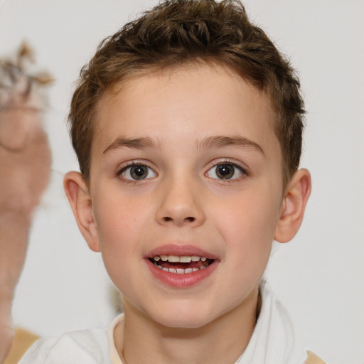 Joyful white child male with short  brown hair and brown eyes