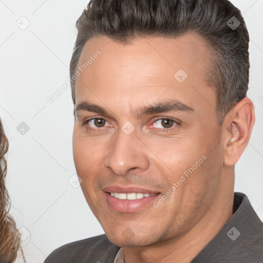 Joyful white adult male with short  brown hair and brown eyes