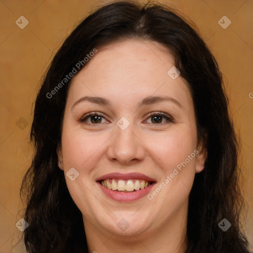 Joyful white adult female with long  brown hair and brown eyes