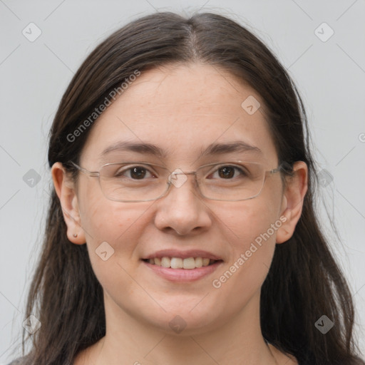 Joyful white adult female with long  brown hair and grey eyes