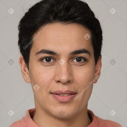 Joyful latino young-adult male with short  brown hair and brown eyes