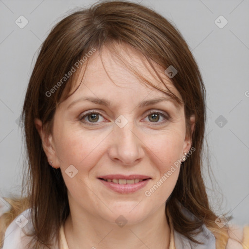 Joyful white adult female with medium  brown hair and grey eyes