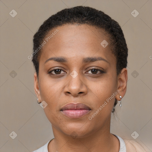 Joyful black young-adult female with short  brown hair and brown eyes