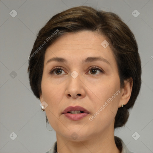 Joyful white adult female with medium  brown hair and brown eyes