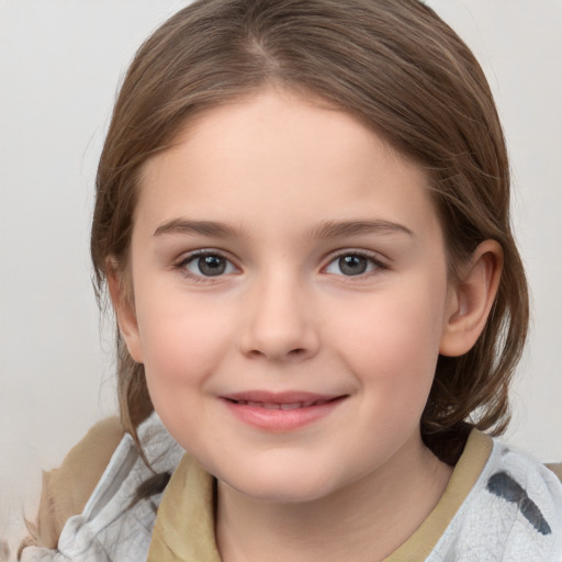 Joyful white child female with medium  brown hair and brown eyes