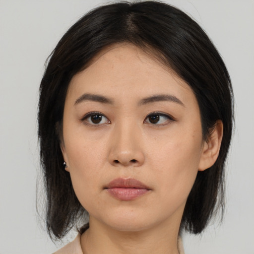 Neutral asian young-adult female with medium  black hair and brown eyes