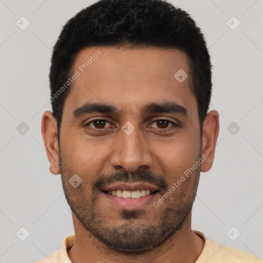 Joyful white young-adult male with short  black hair and brown eyes