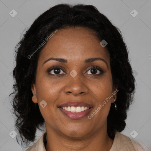 Joyful black adult female with medium  brown hair and brown eyes