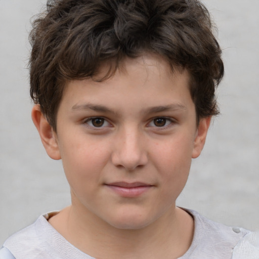 Joyful white child male with short  brown hair and brown eyes