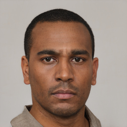 Neutral black young-adult male with short  black hair and brown eyes