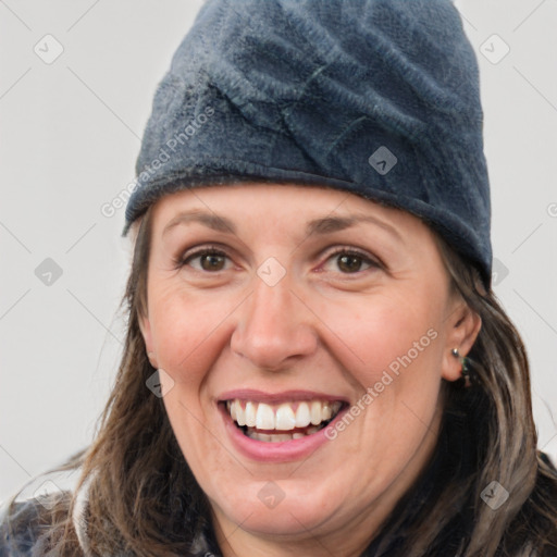 Joyful white adult female with medium  brown hair and grey eyes