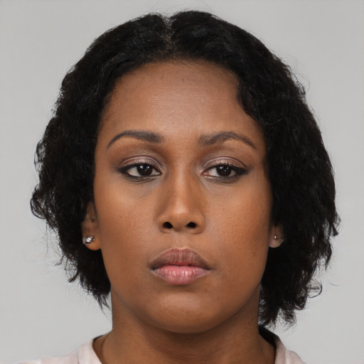 Neutral black young-adult female with medium  black hair and brown eyes