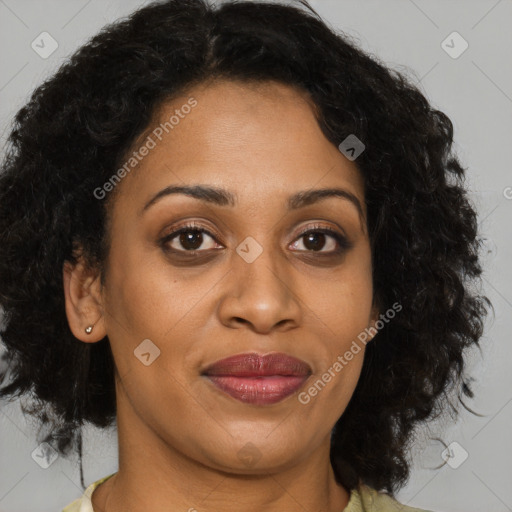 Joyful latino adult female with medium  brown hair and brown eyes