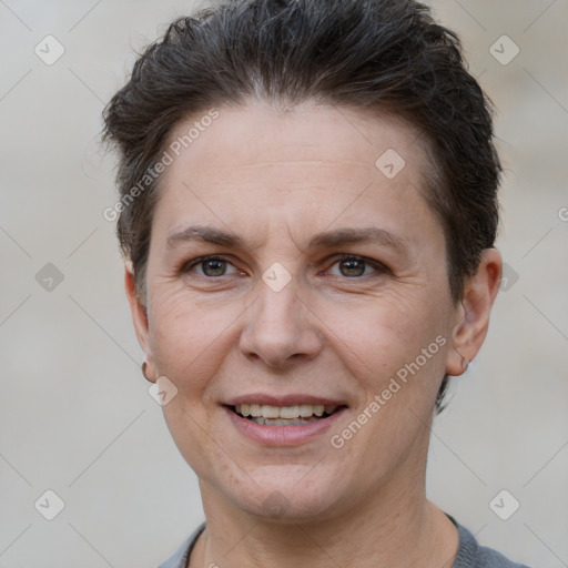 Joyful white adult female with short  brown hair and brown eyes