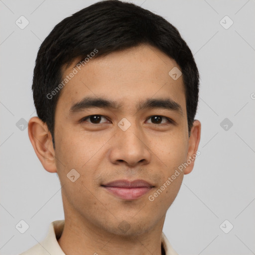 Joyful latino young-adult male with short  black hair and brown eyes