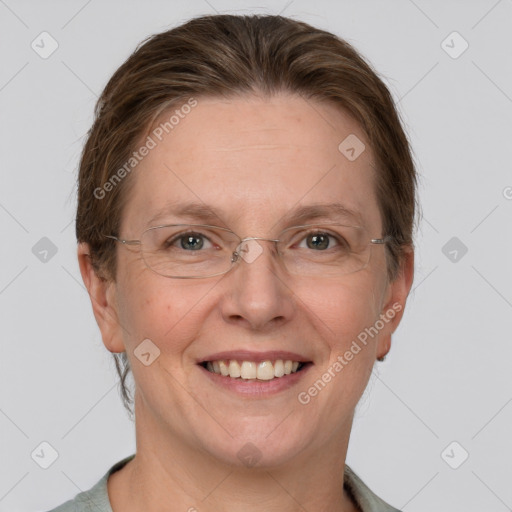 Joyful white adult female with short  brown hair and grey eyes