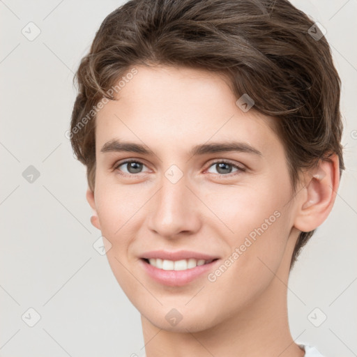 Joyful white young-adult female with short  brown hair and grey eyes