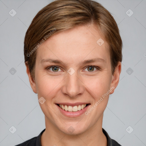 Joyful white young-adult female with short  brown hair and grey eyes