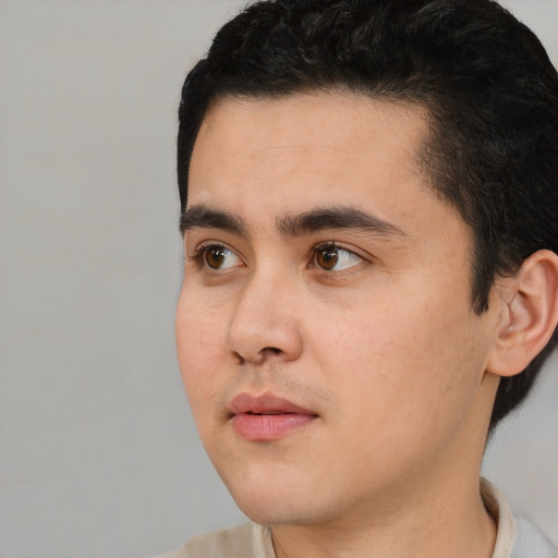 Neutral white young-adult male with short  black hair and brown eyes
