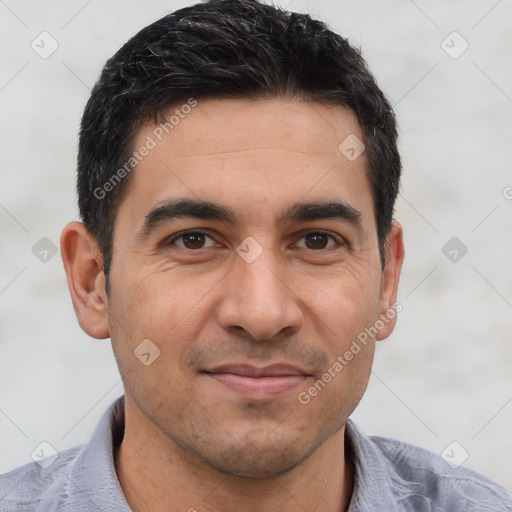 Joyful white young-adult male with short  black hair and brown eyes