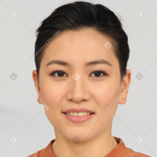 Joyful asian young-adult female with short  brown hair and brown eyes