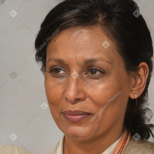 Joyful black adult female with medium  brown hair and brown eyes