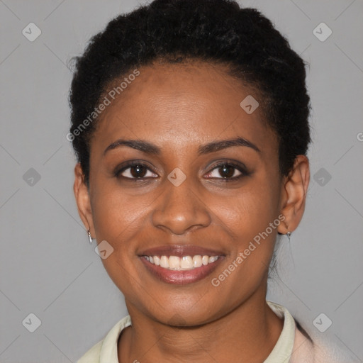 Joyful black young-adult female with short  brown hair and brown eyes