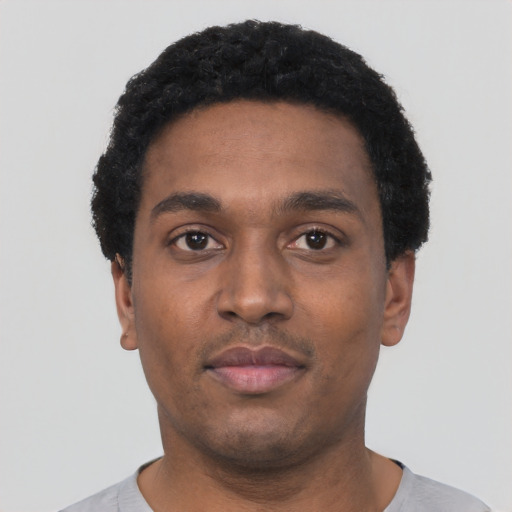 Neutral black young-adult male with short  black hair and brown eyes