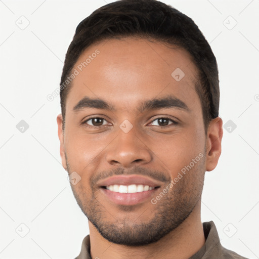 Joyful latino young-adult male with short  brown hair and brown eyes