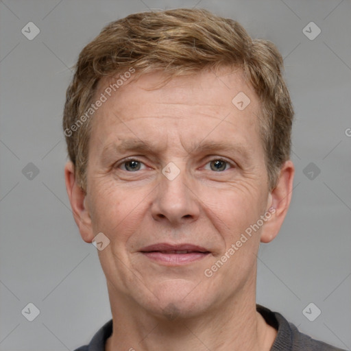 Joyful white adult male with short  brown hair and grey eyes