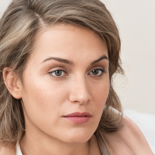 Neutral white young-adult female with medium  brown hair and grey eyes