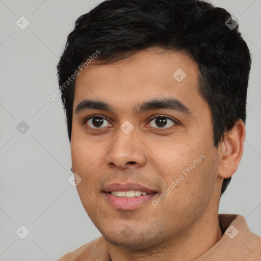 Joyful latino young-adult male with short  black hair and brown eyes