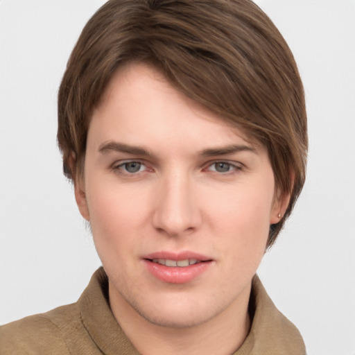 Joyful white young-adult female with short  brown hair and grey eyes