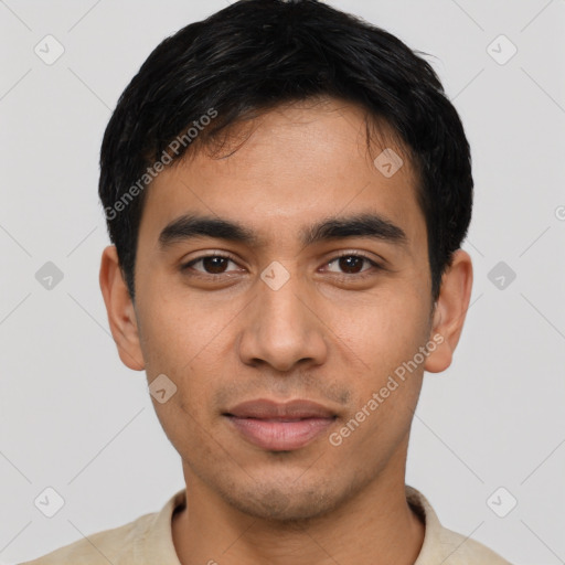 Joyful latino young-adult male with short  black hair and brown eyes