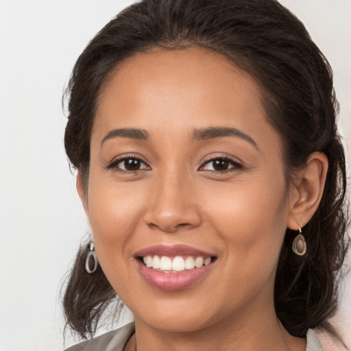 Joyful white young-adult female with medium  brown hair and brown eyes