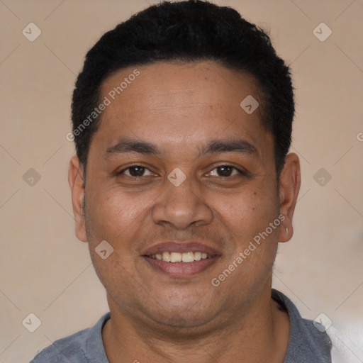 Joyful latino adult male with short  black hair and brown eyes