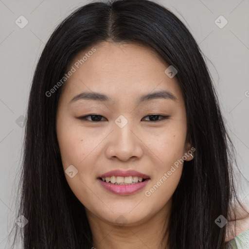 Joyful asian young-adult female with long  brown hair and brown eyes